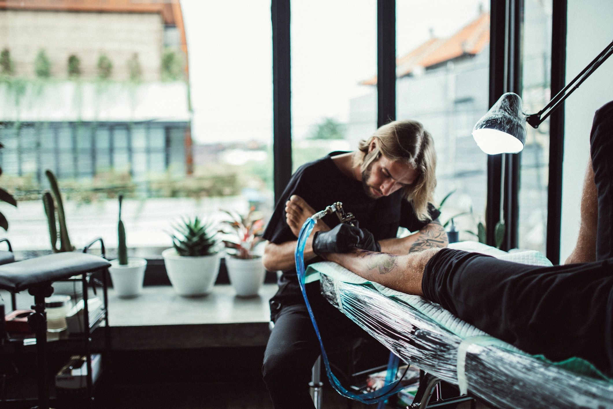 tattoo artist at work modern studio